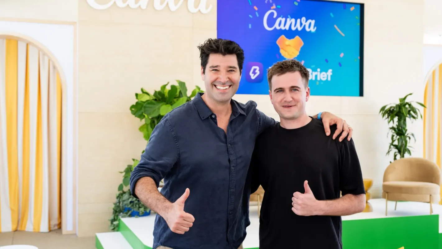 Cliff Obrecht, Canva’s co-founder and chief operating officer, and George Howes, co-founder and CEO of MagicBrief, pose for a photo at the Cannes Lions festival in Cannes, France